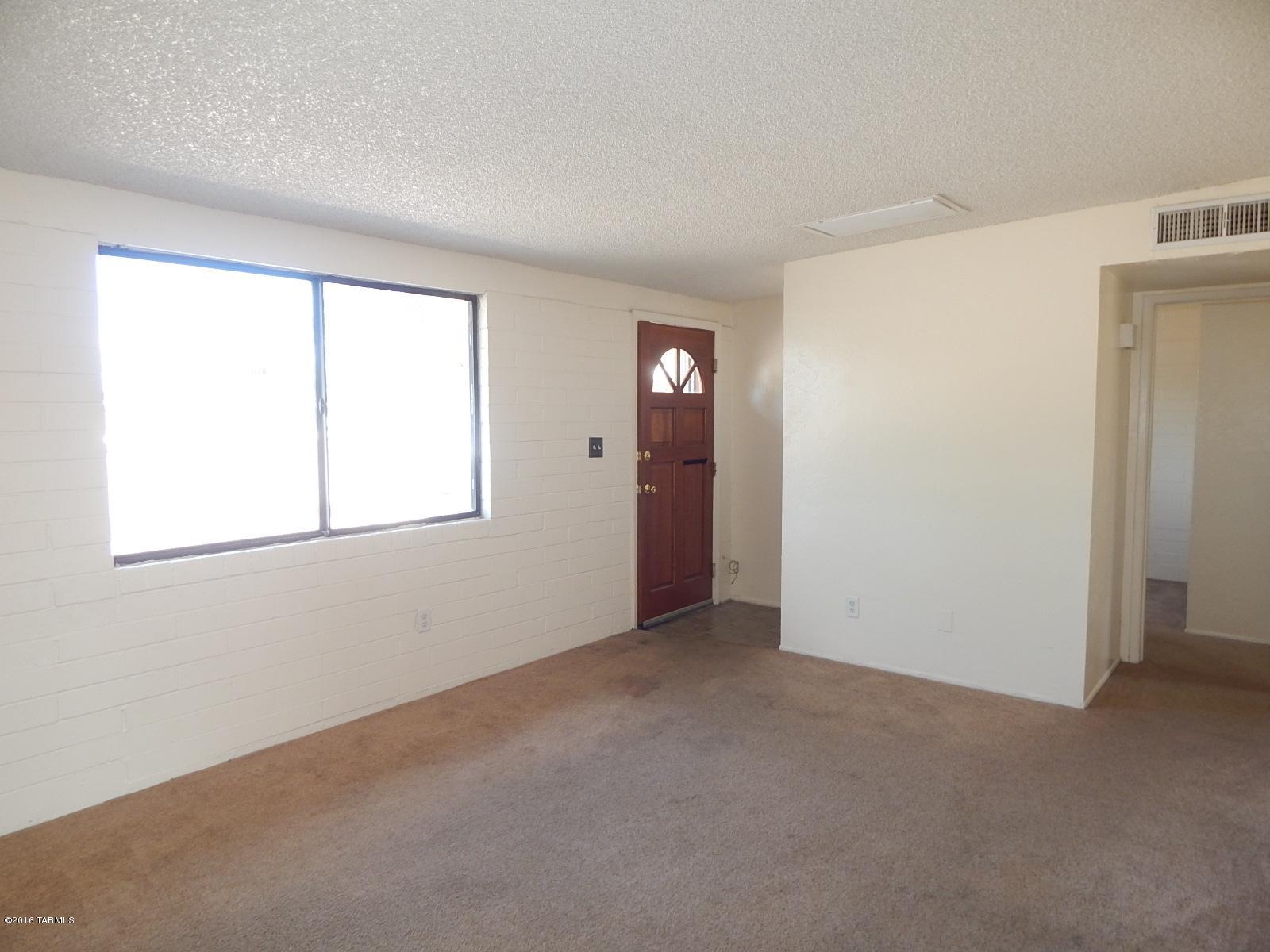 1527 West Roger Road Tucson, AZ 85705 - Photo 3 of 14 a view of an empty room with a window