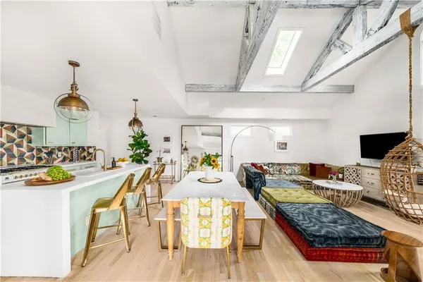 a bedroom with furniture and a wooden floor