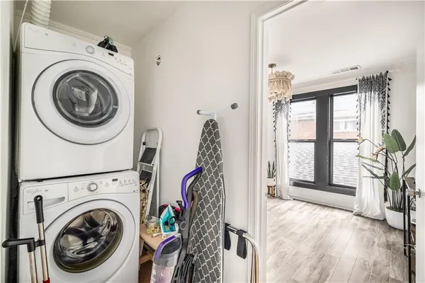 a view of a hallway with washer and dryer