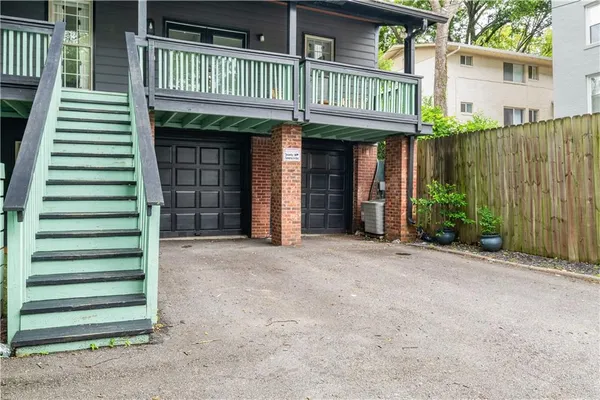 a view of a house with a porch and furniture