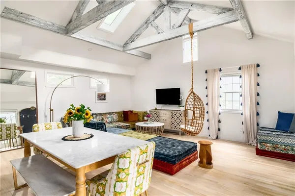 a living room with furniture and flat screen tv