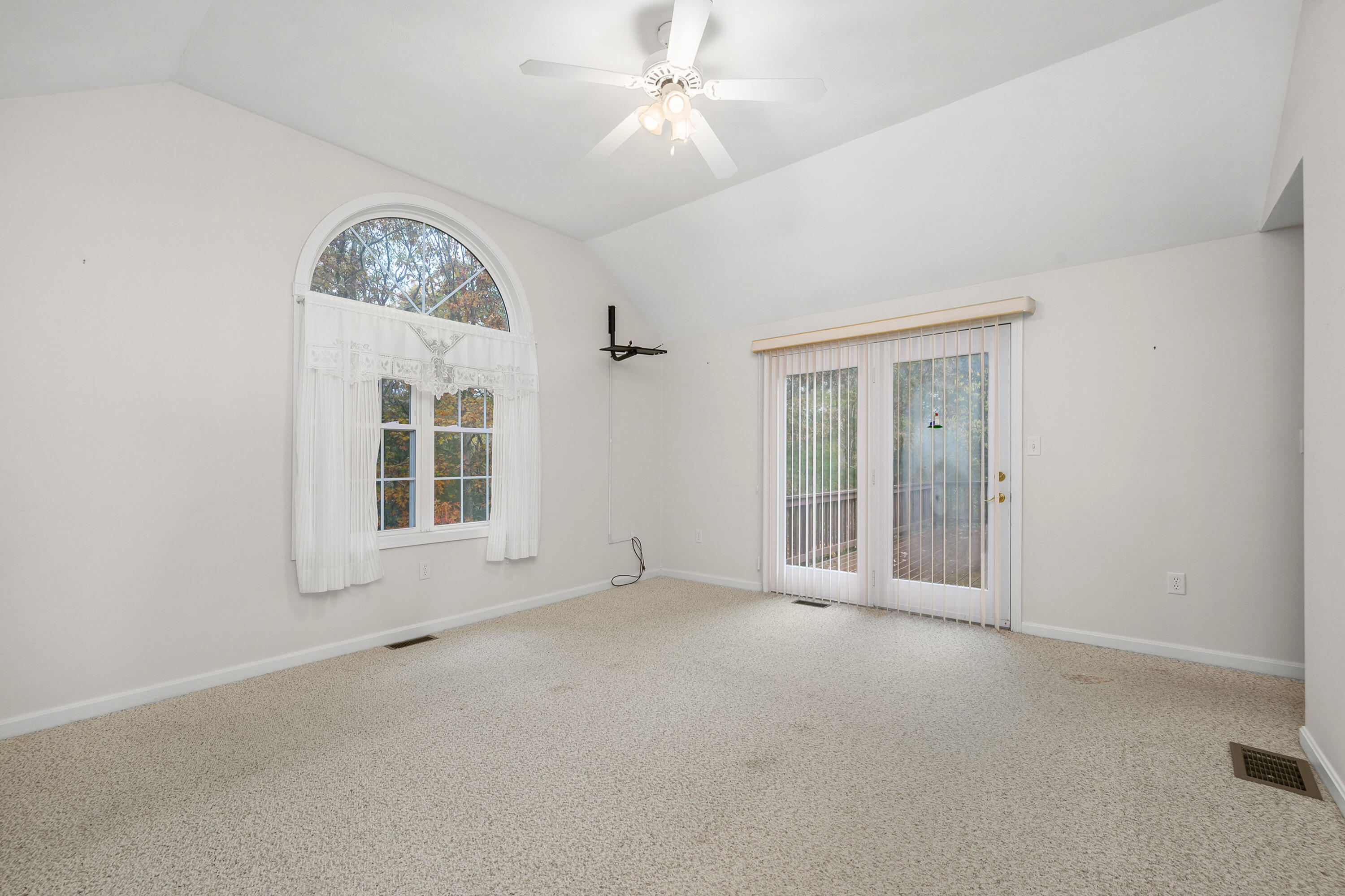 105 Snead Drive Mashpee, MA 02649 - Photo 17 of 35 an empty room with windows and fan