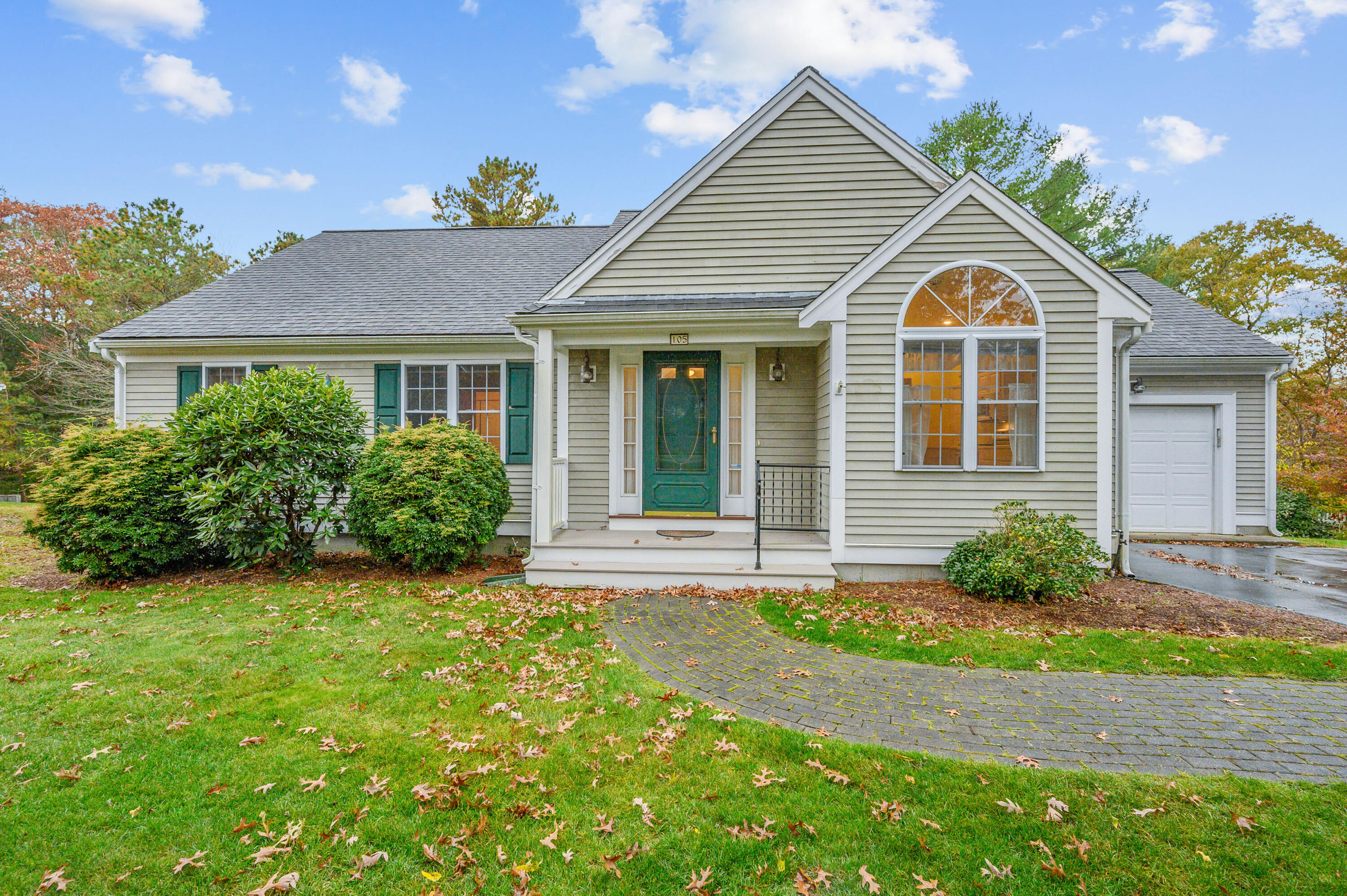 105 Snead Drive Mashpee, MA 02649 - Photo 2 of 35 a front view of a house with garden