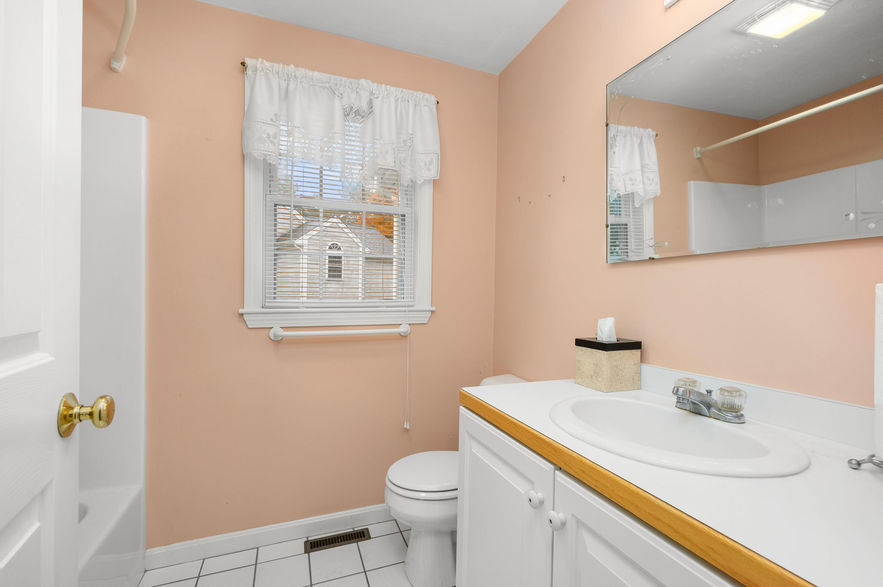 105 Snead Drive Mashpee, MA 02649 - Photo 22 of 35 a bathroom with a sink vanity mirror and toilet