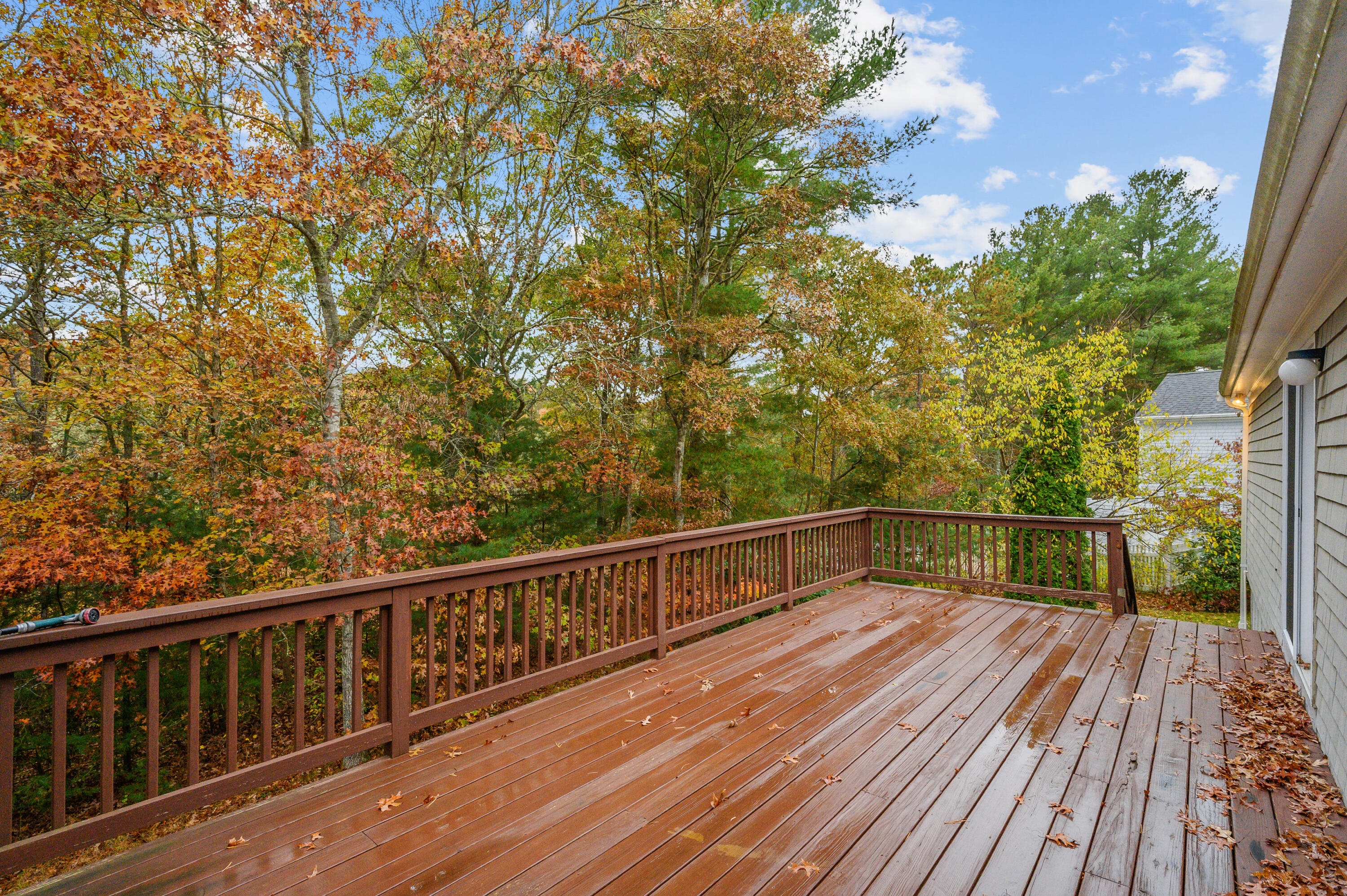 105 Snead Drive Mashpee, MA 02649 - Photo 30 of 35 a view of balcony with wooden floor and fence