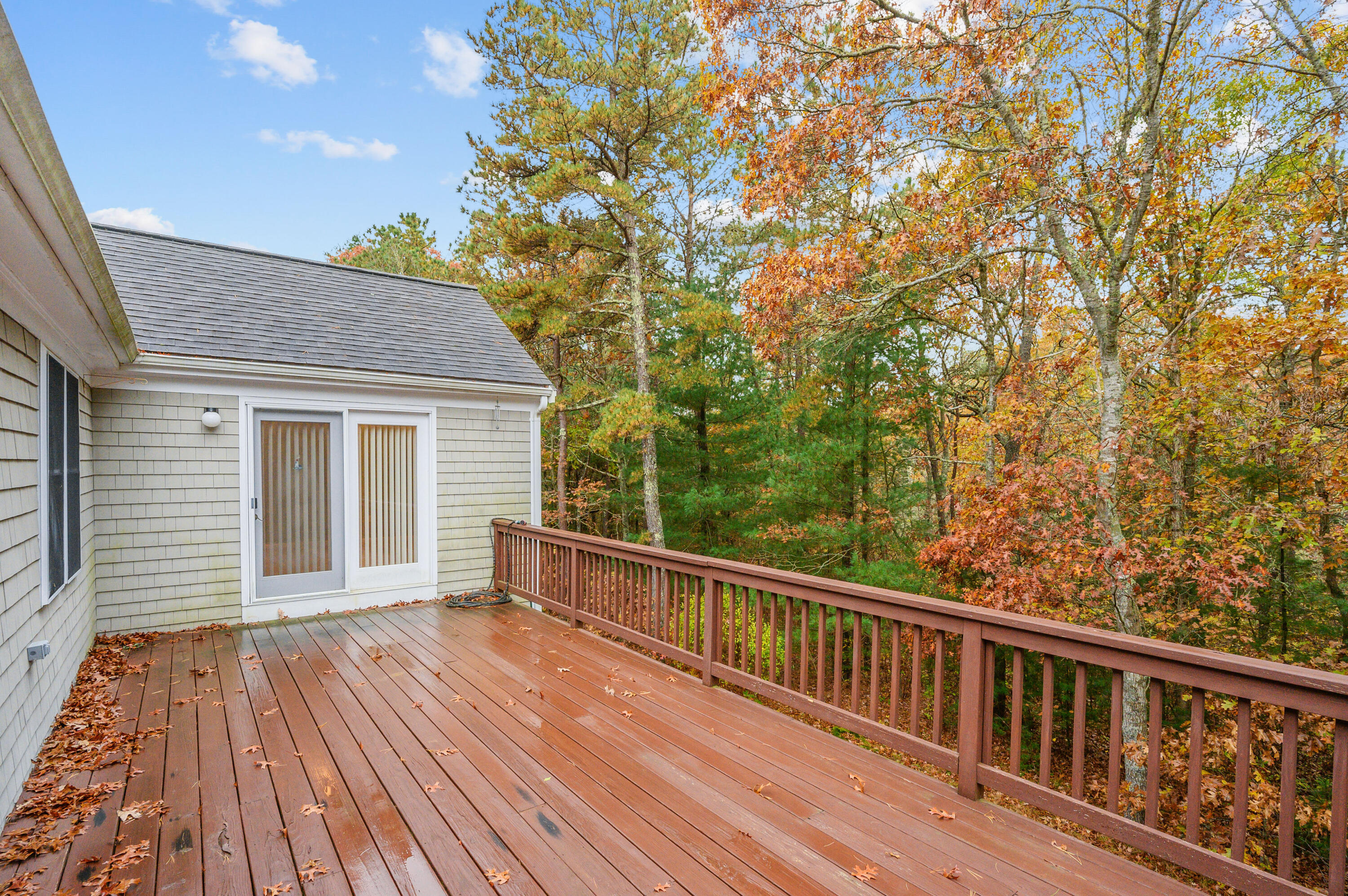 105 Snead Drive Mashpee, MA 02649 - Photo 31 of 35 a view of a wooden chairs on a deck