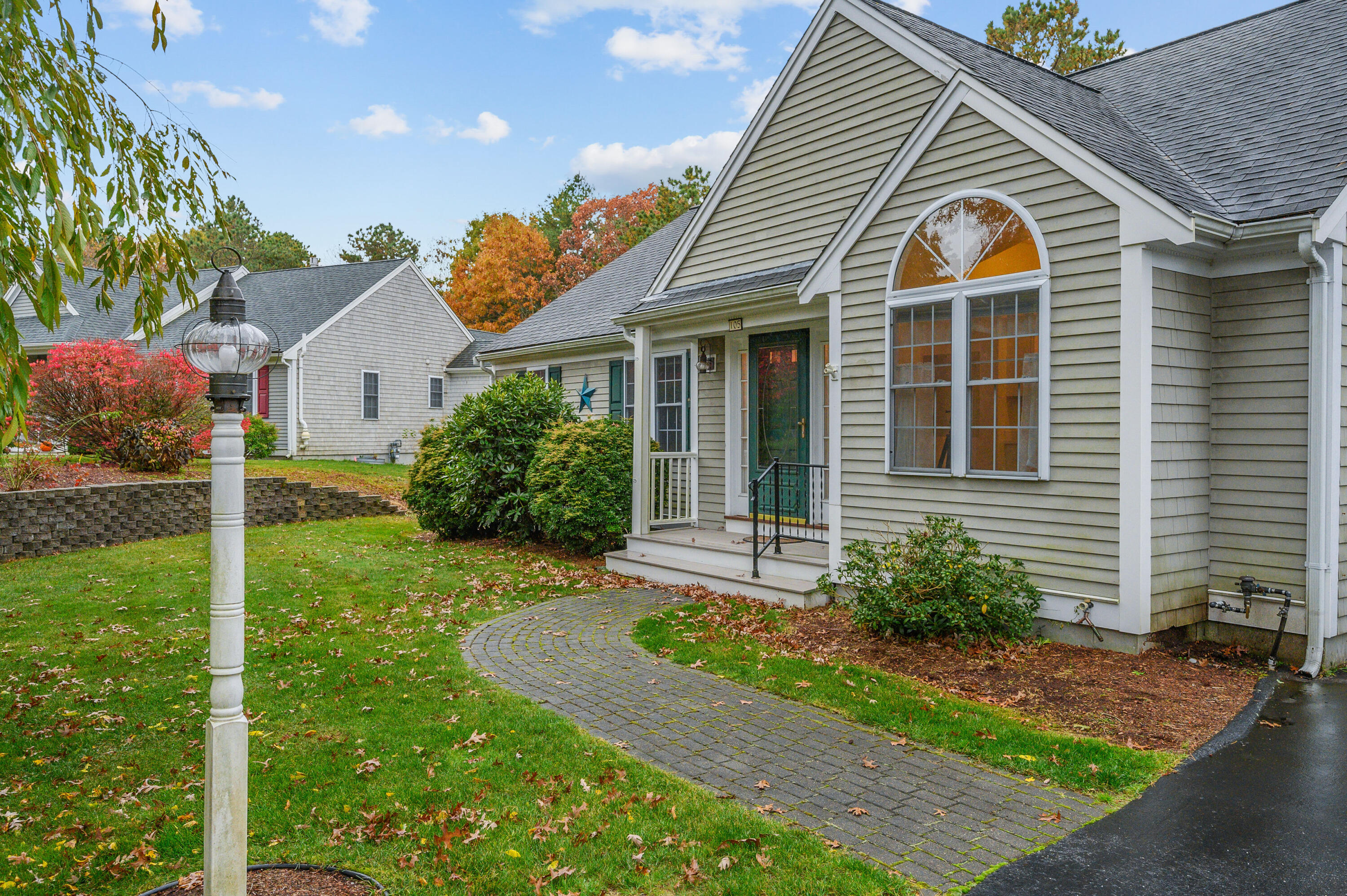 105 Snead Drive Mashpee, MA 02649 - Photo 4 of 35 a front view of house with yard and green space