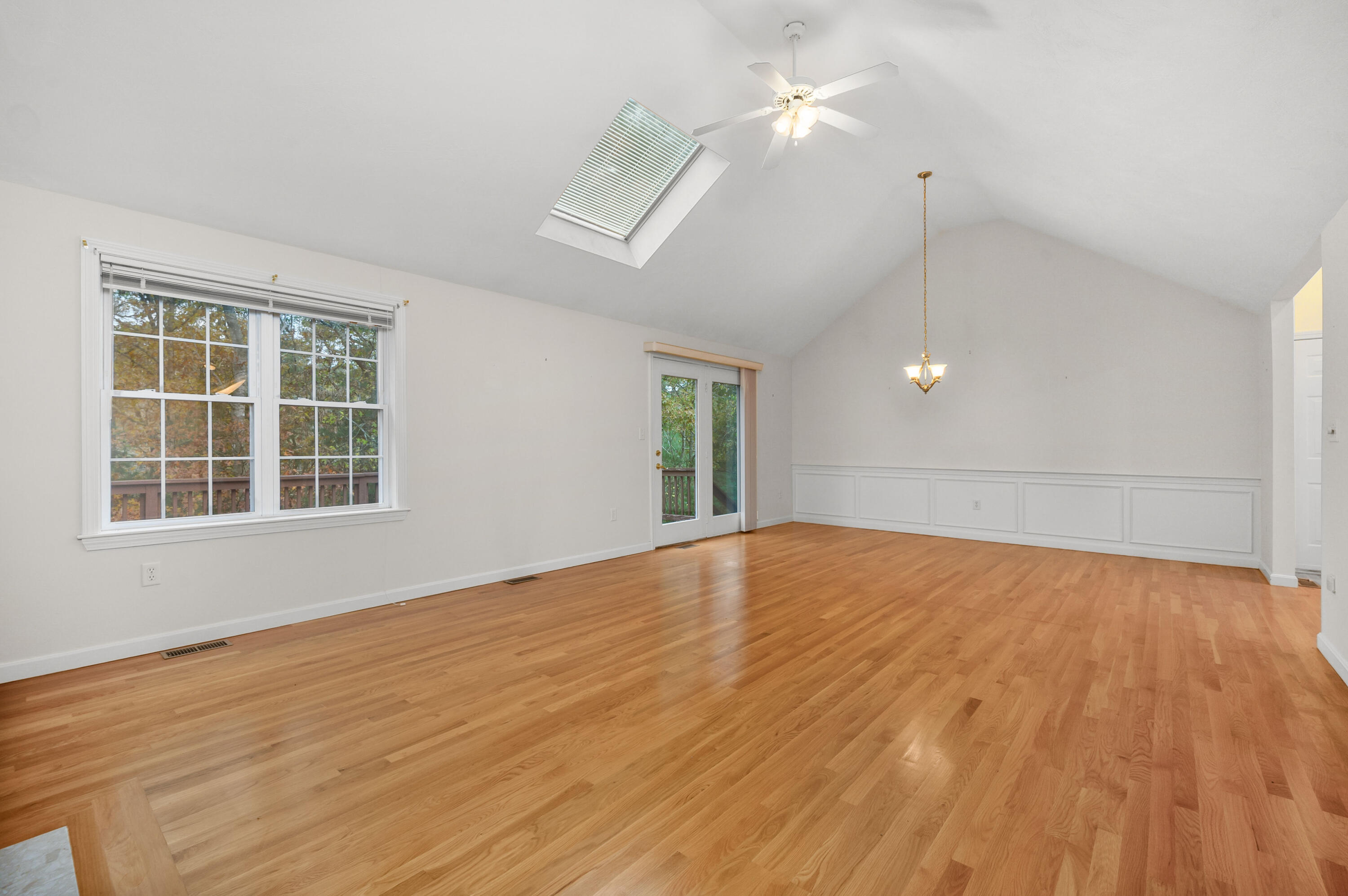 105 Snead Drive Mashpee, MA 02649 - Photo 7 of 35 a view of an empty room with wooden floor and a window