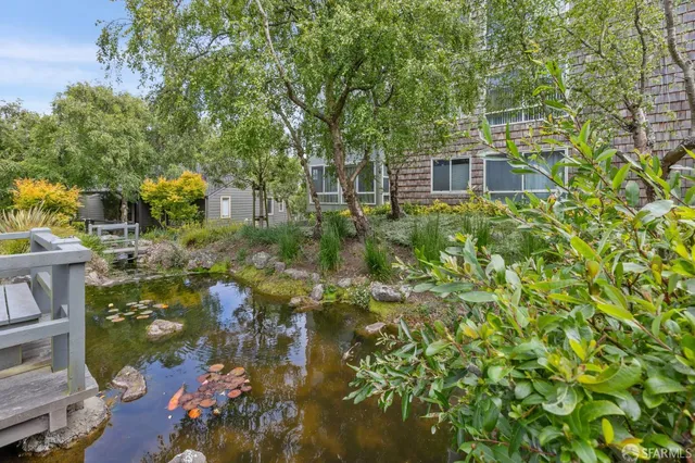 a wooden sign board with a house