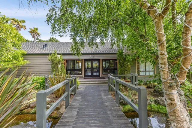 a view of a kitchen with a large window