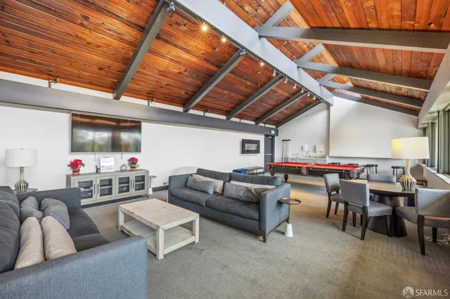a bedroom with furniture and a chandelier