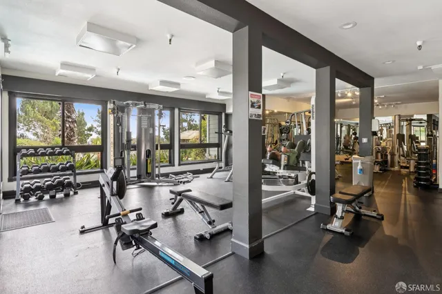a bathroom with a tub a sink and a shower