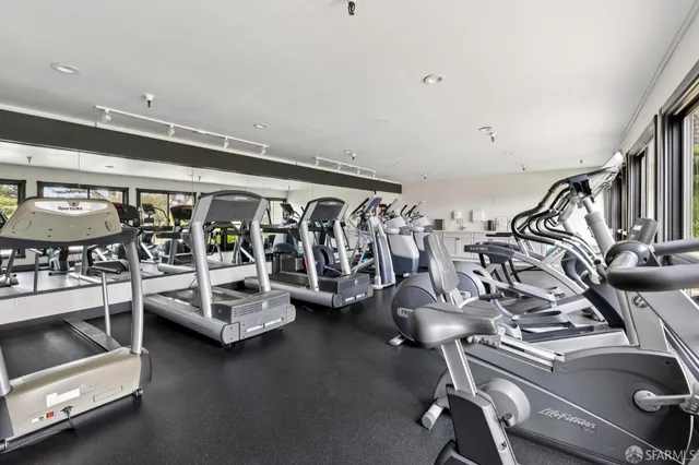 a bathroom with a tub a sink and a shower