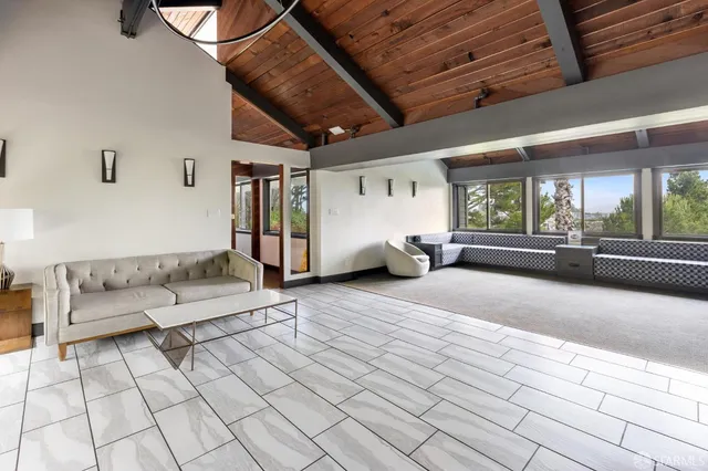 a bathroom with a shower curtain and a window