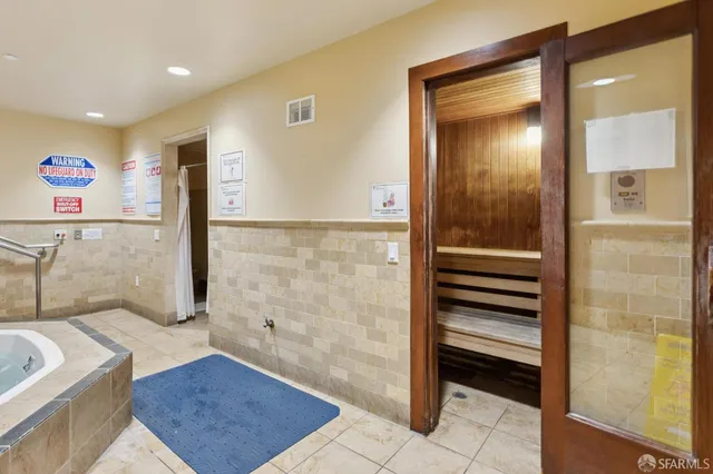 a front view of residential houses with yard and swimming pool