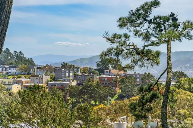 a view of a wooden door with a bench
