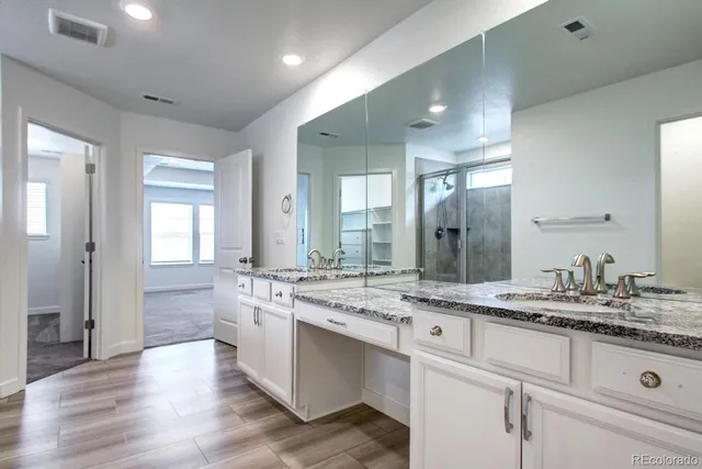 a bathroom with a glass shower door