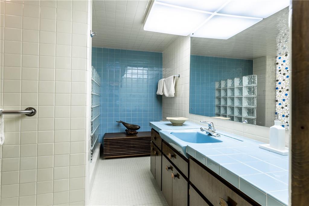 385 Richard Road Wexford, PA 15090 - Photo 17 of 25 The Sellers Absolutely Love the Mid-Century Modern Style and Have Not Changed Much Since it was Constructed in 1960. Here is the Master Bath with Stained Glass and a Step-Down Shower.