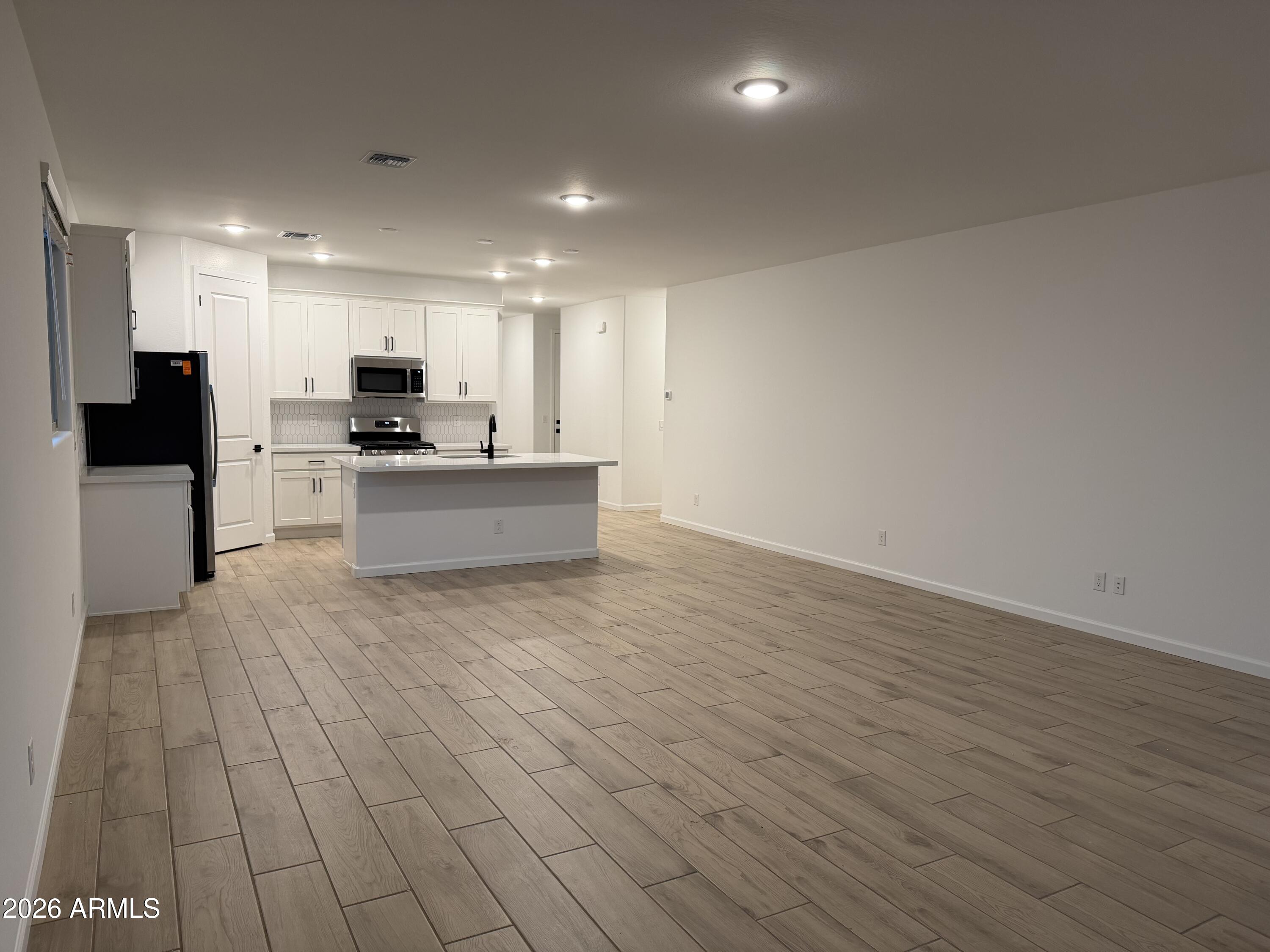 5540 West Piedmont Road Laveen, AZ 85339 - Photo 13 of 31 0012_ Great Room & Kitchen