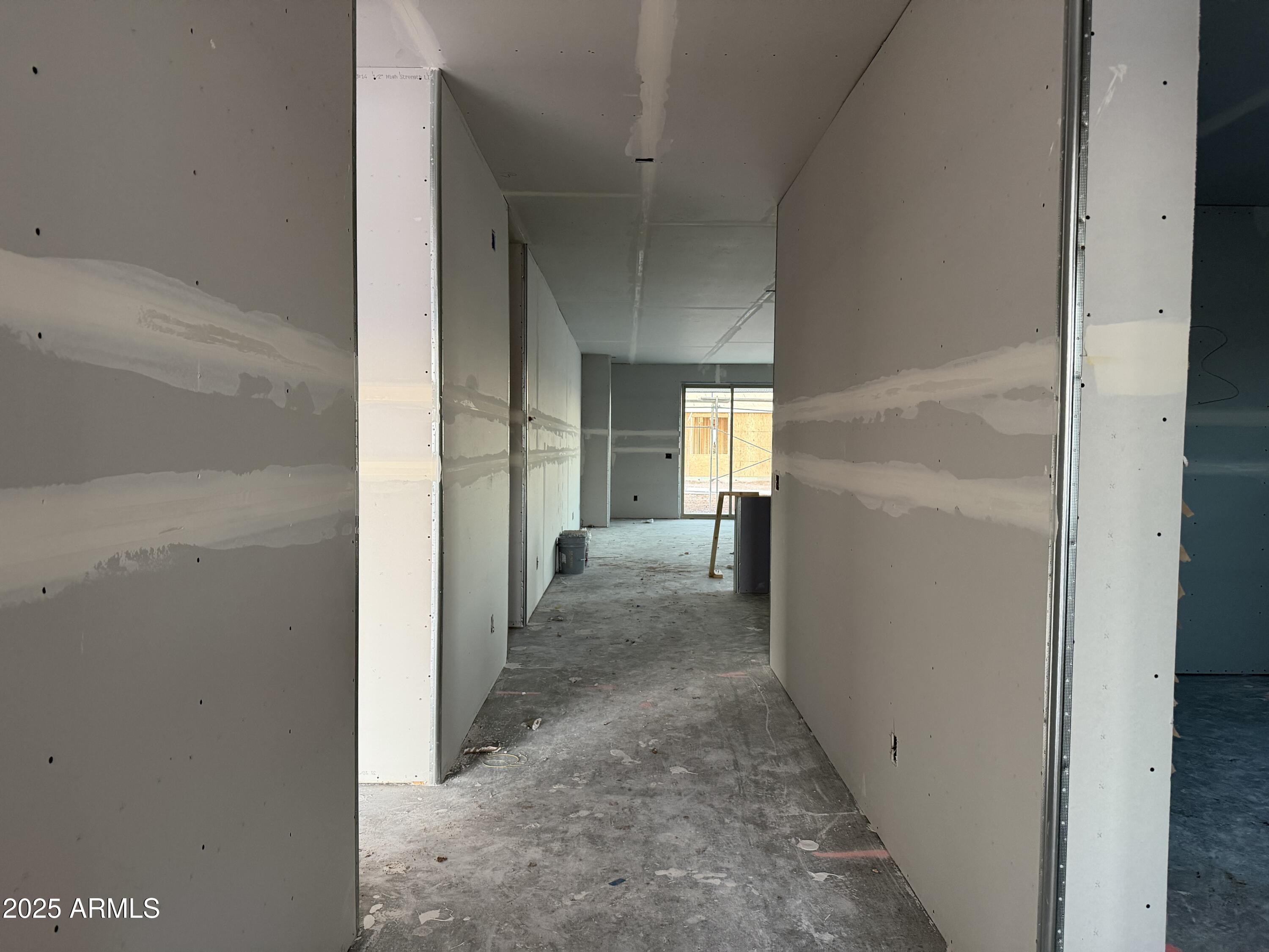 5540 West Piedmont Road Laveen, AZ 85339 - Photo 3 of 26 a view of a hallway with a livingroom and a bathroom