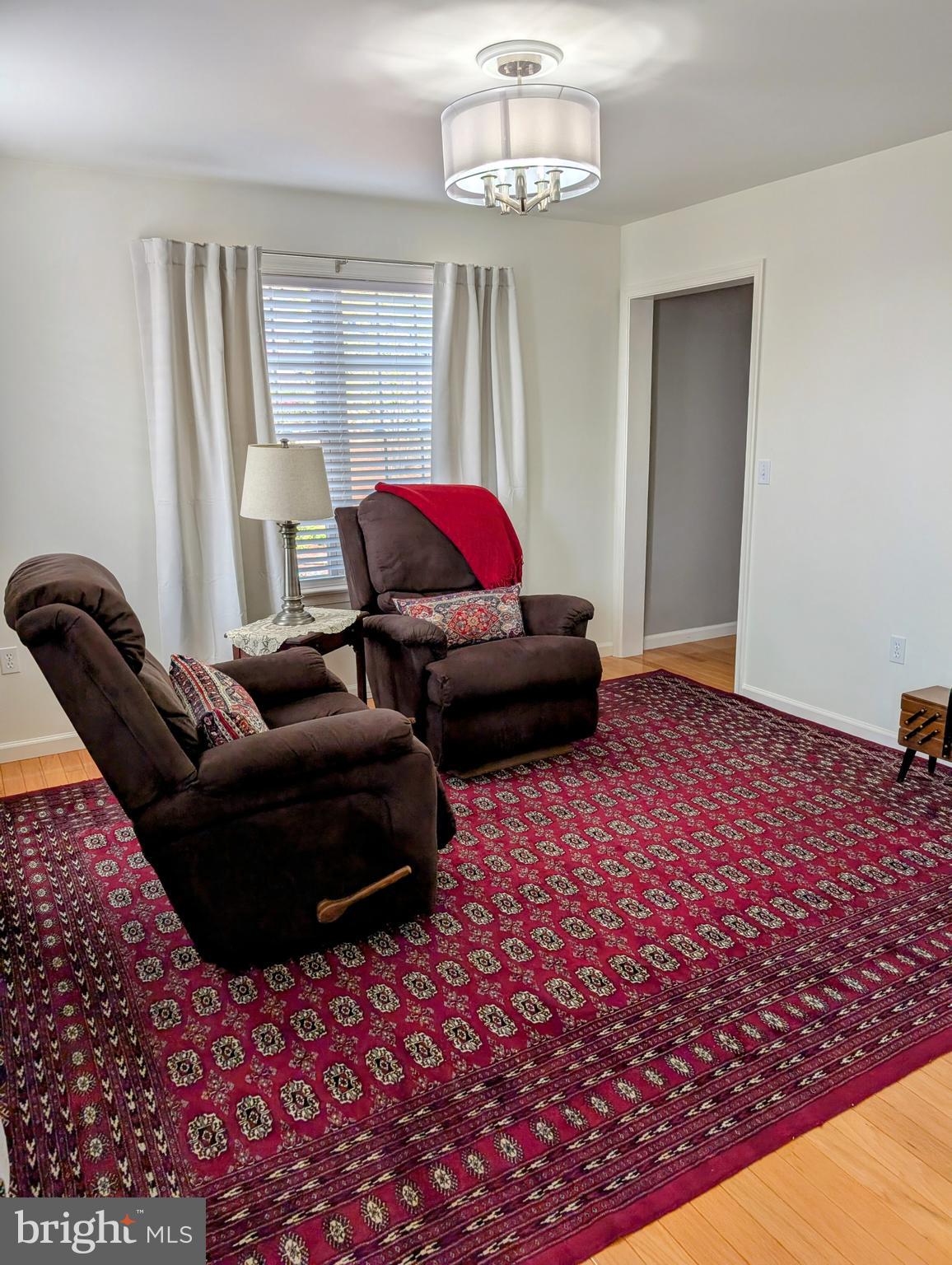 5495 Deer Path Lane Gap, PA 17527 - Photo 12 of 38 a living room with furniture and a chandelier