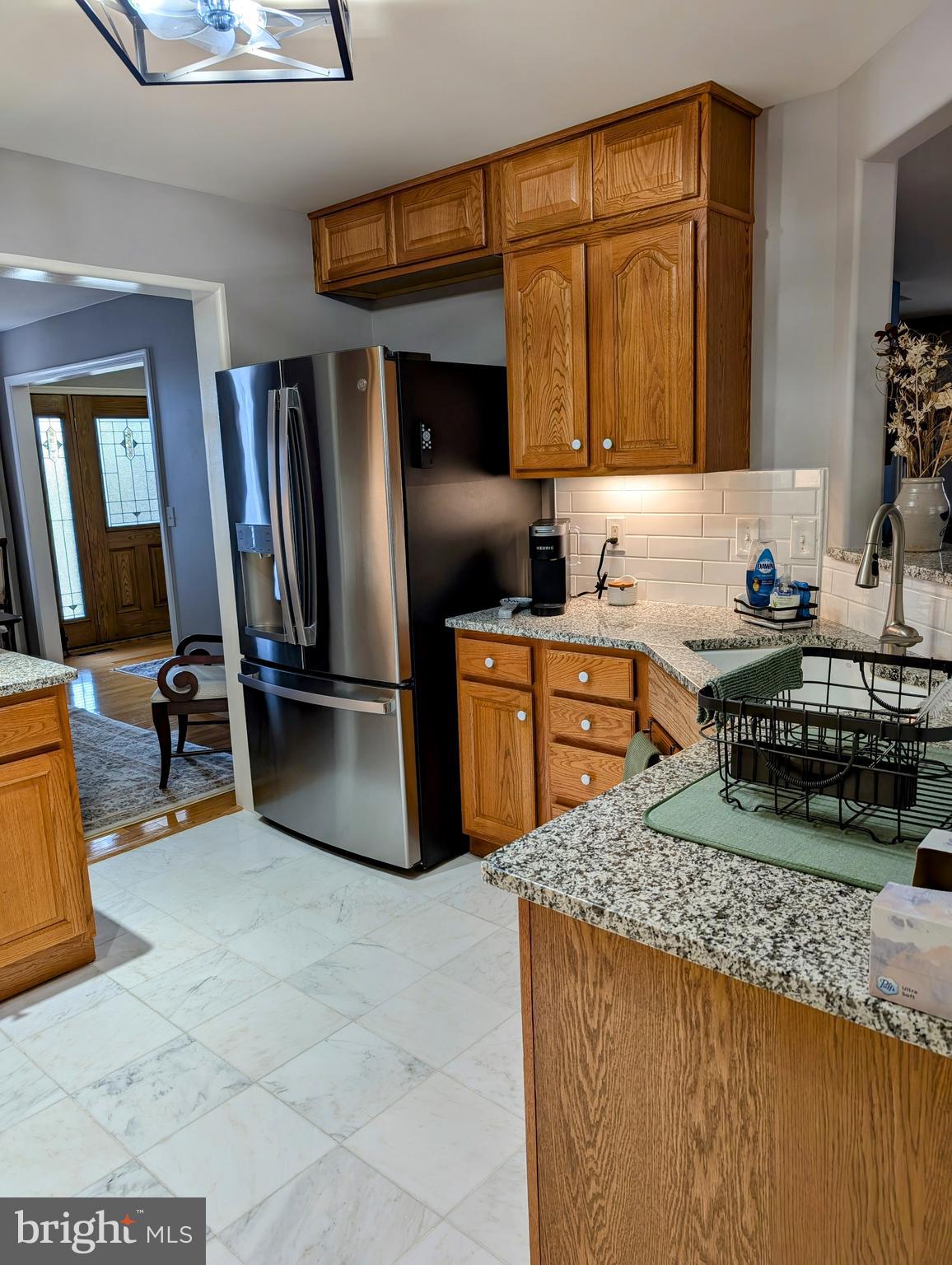 5495 Deer Path Lane Gap, PA 17527 - Photo 15 of 38 a kitchen with stainless steel appliances granite countertop a sink stove and refrigerator