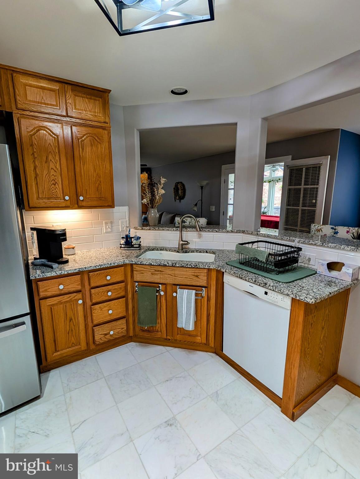 5495 Deer Path Lane Gap, PA 17527 - Photo 17 of 38 a kitchen with stainless steel appliances granite countertop a sink stove and cabinets