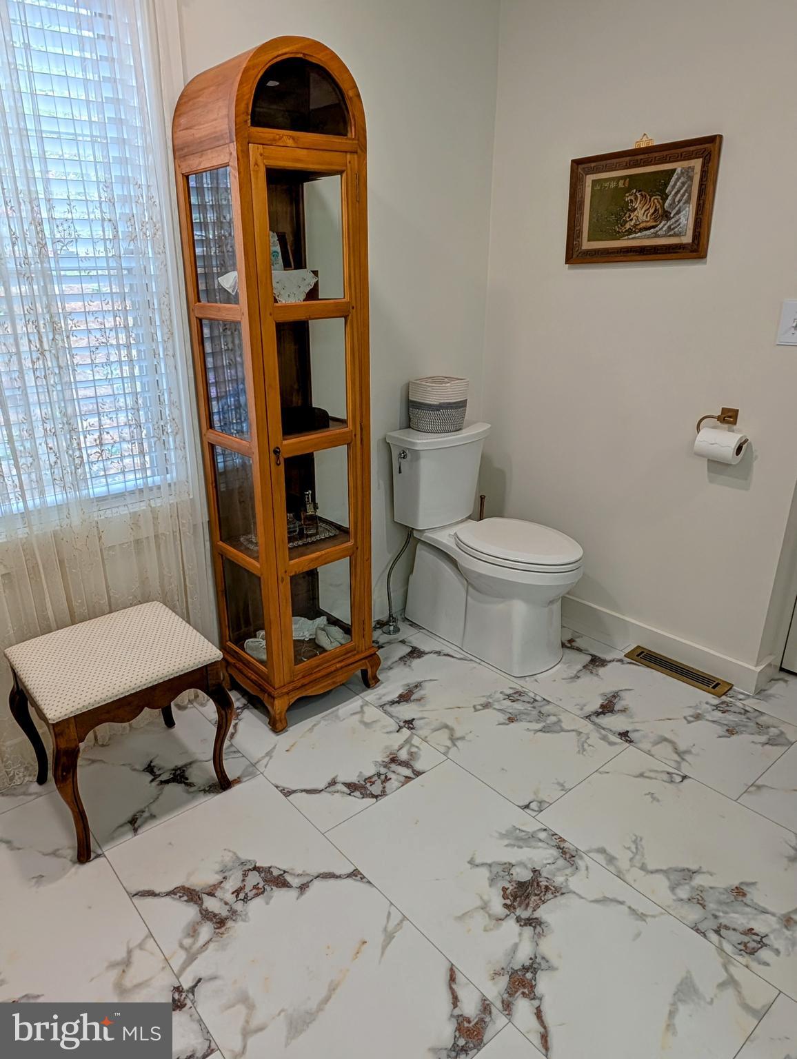 5495 Deer Path Lane Gap, PA 17527 - Photo 23 of 38 a living room with a baby crib furniture and a toilet
