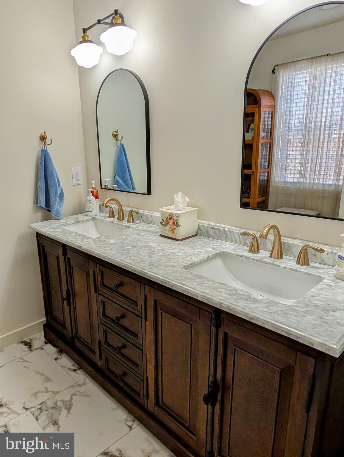 5495 Deer Path Lane Gap, PA 17527 - Photo 24 of 38 a bathroom with a granite countertop sink and a mirror