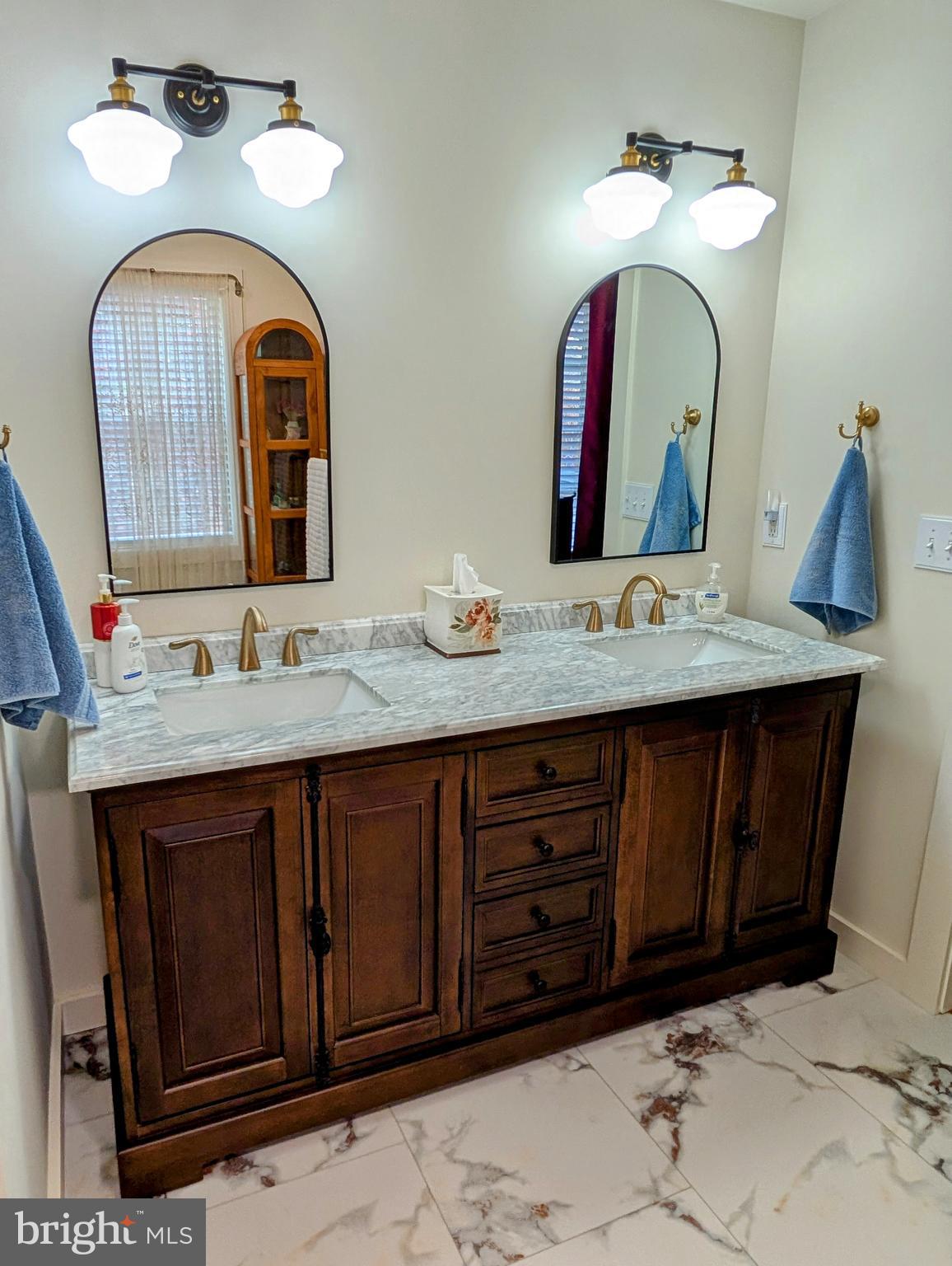 5495 Deer Path Lane Gap, PA 17527 - Photo 25 of 38 a bathroom with a granite countertop double vanity sink and a mirror