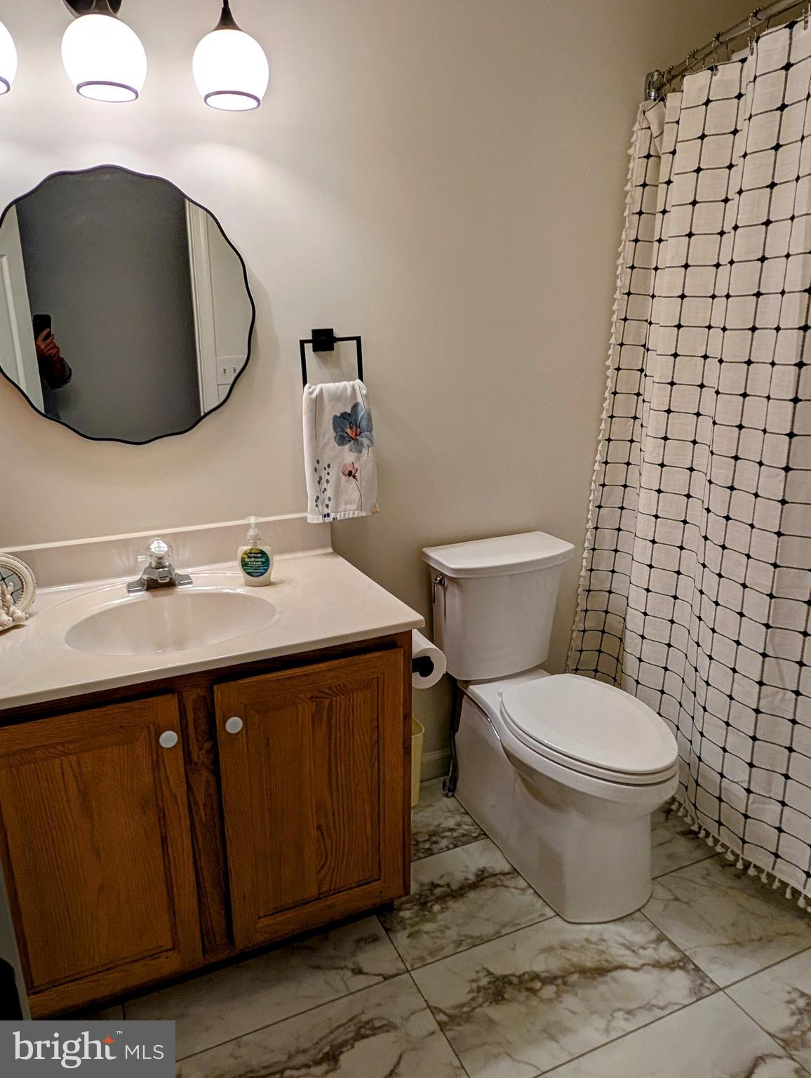 5495 Deer Path Lane Gap, PA 17527 - Photo 32 of 38 a bathroom with a sink toilet and mirror