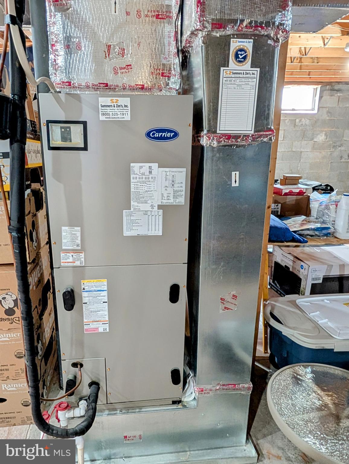 5495 Deer Path Lane Gap, PA 17527 - Photo 37 of 38 a view of water heater room with washer and dryer