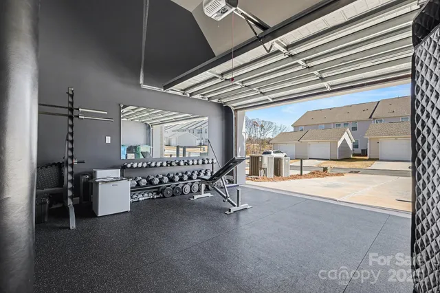 a dining room with furniture and a kitchen