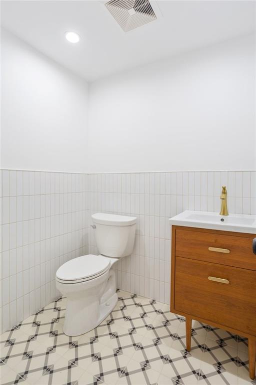 760 Decatur Street Brooklyn, NY 11233 - Photo 10 of 12 a bathroom with a toilet and a sink