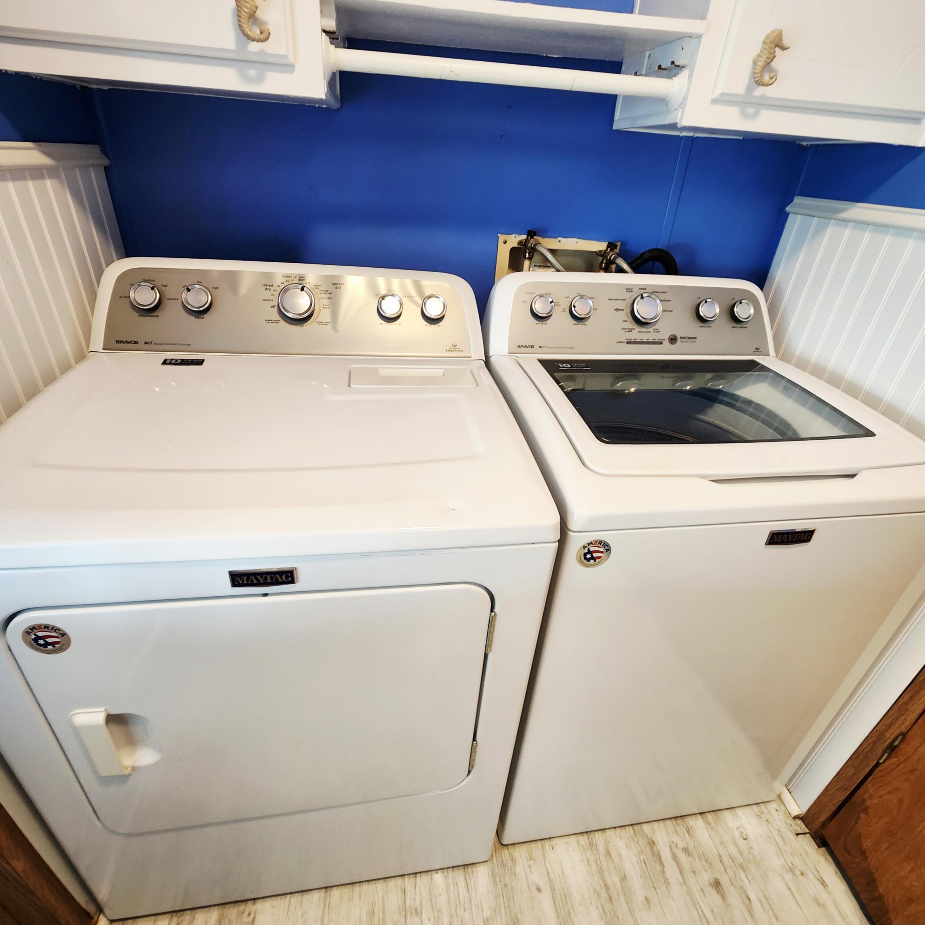 526 Hemingway Terrace, Unit F02 Fort Pierce, FL 34982 - Photo 14 of 55 a utility room with dryer and washer