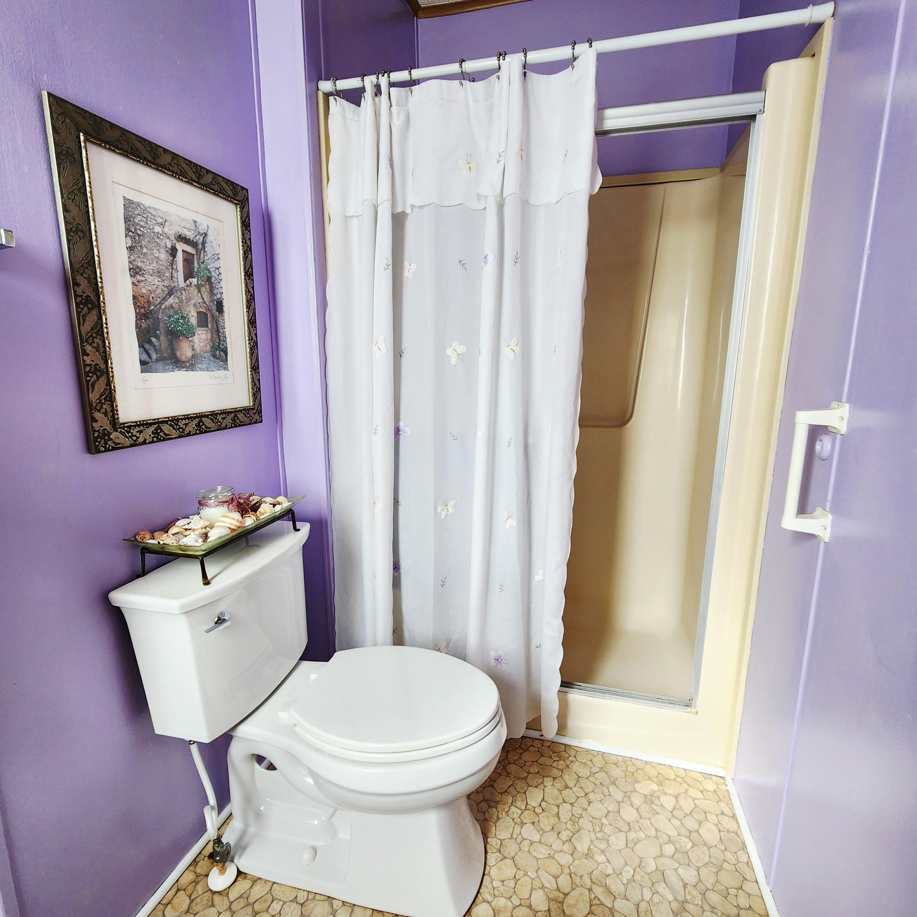 526 Hemingway Terrace, Unit F02 Fort Pierce, FL 34982 - Photo 34 of 55 a bathroom with a toilet and shower