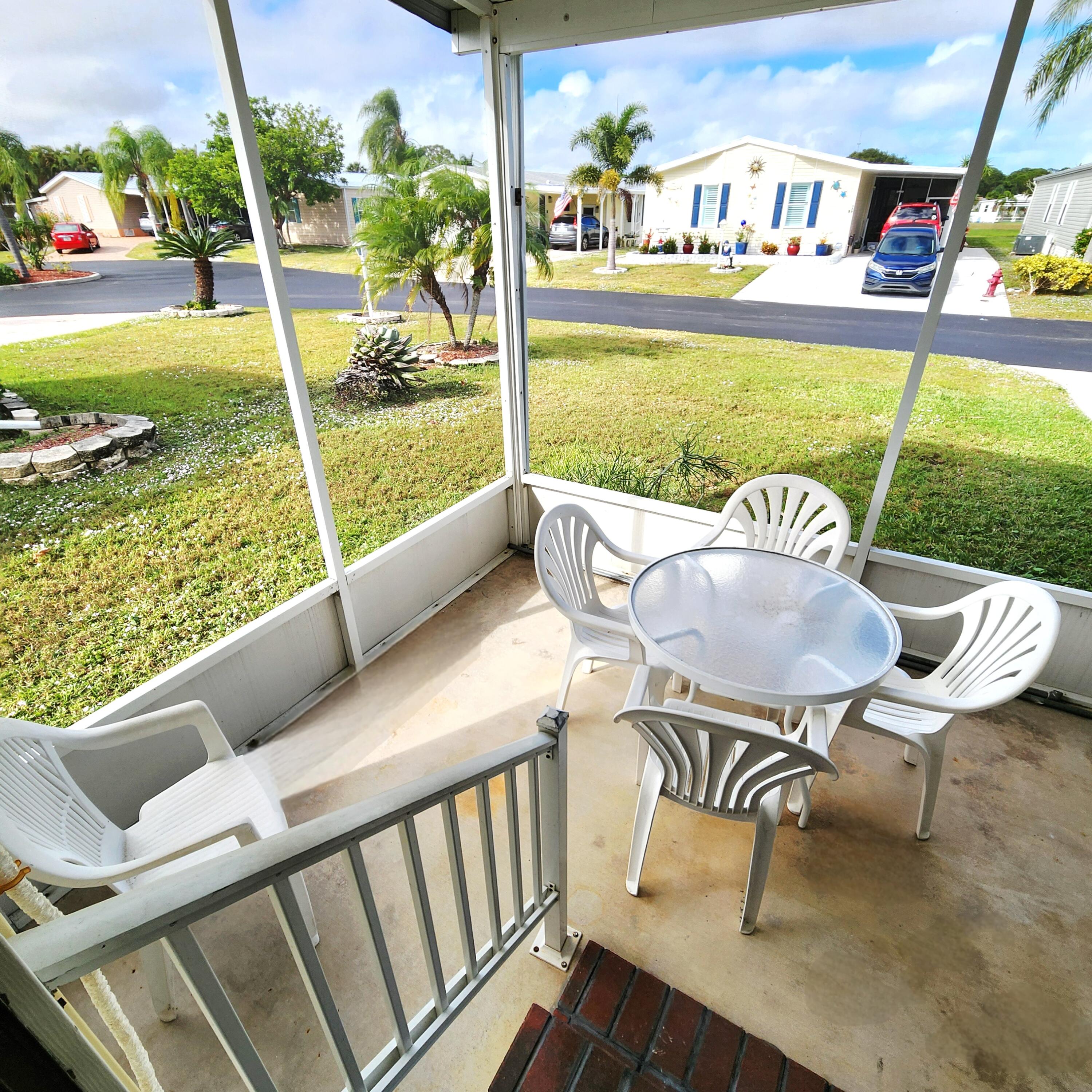 526 Hemingway Terrace, Unit F02 Fort Pierce, FL 34982 - Photo 35 of 55 a view of a chairs and table in patio