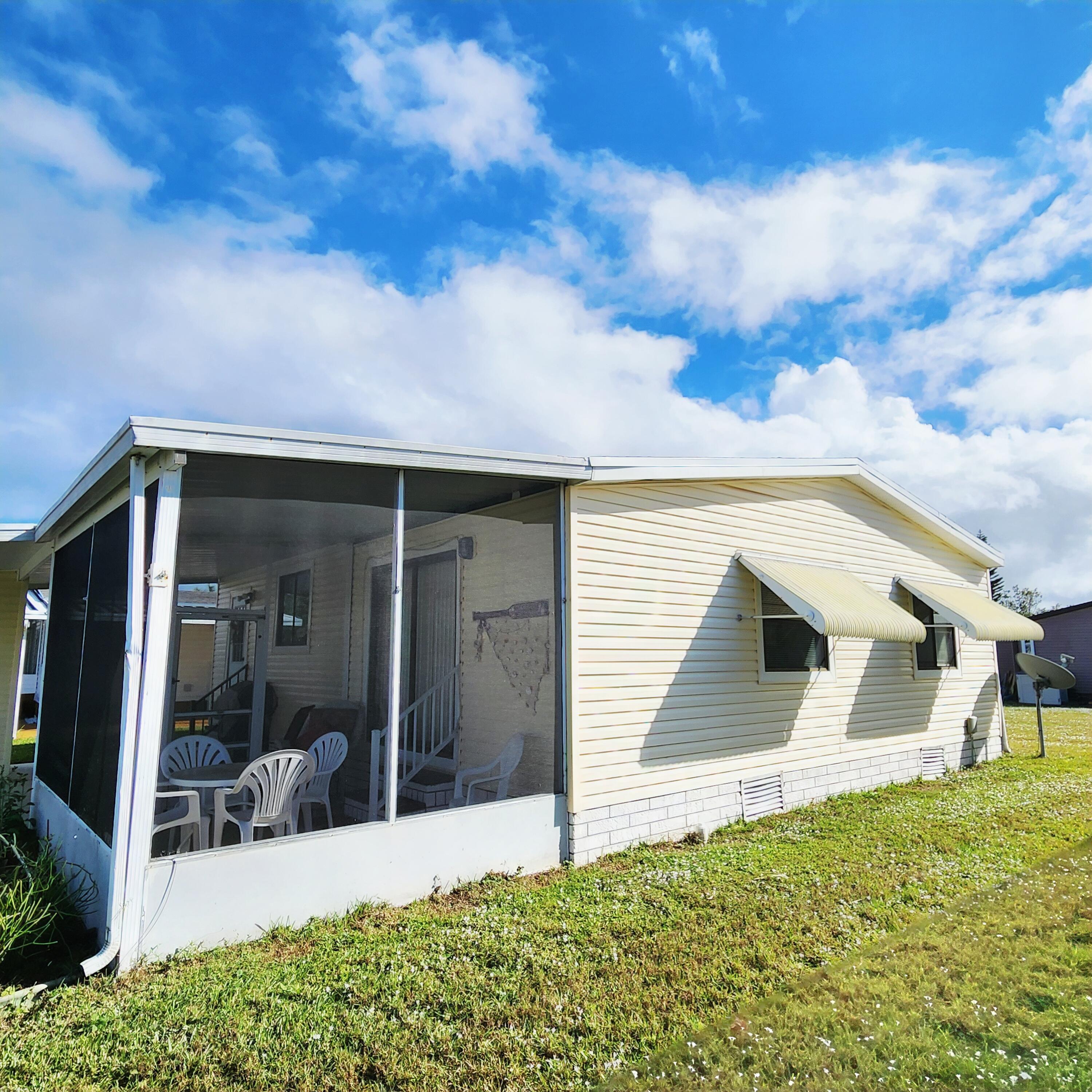 526 Hemingway Terrace, Unit F02 Fort Pierce, FL 34982 - Photo 42 of 55 a view of house with backyard