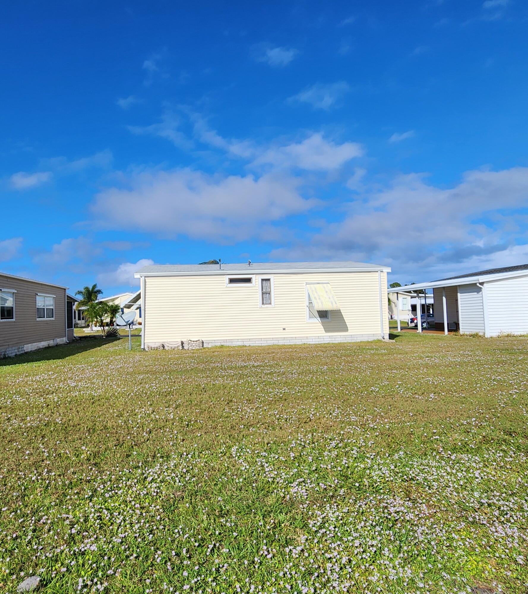 526 Hemingway Terrace, Unit F02 Fort Pierce, FL 34982 - Photo 44 of 55 a view of a big room with table and chairs