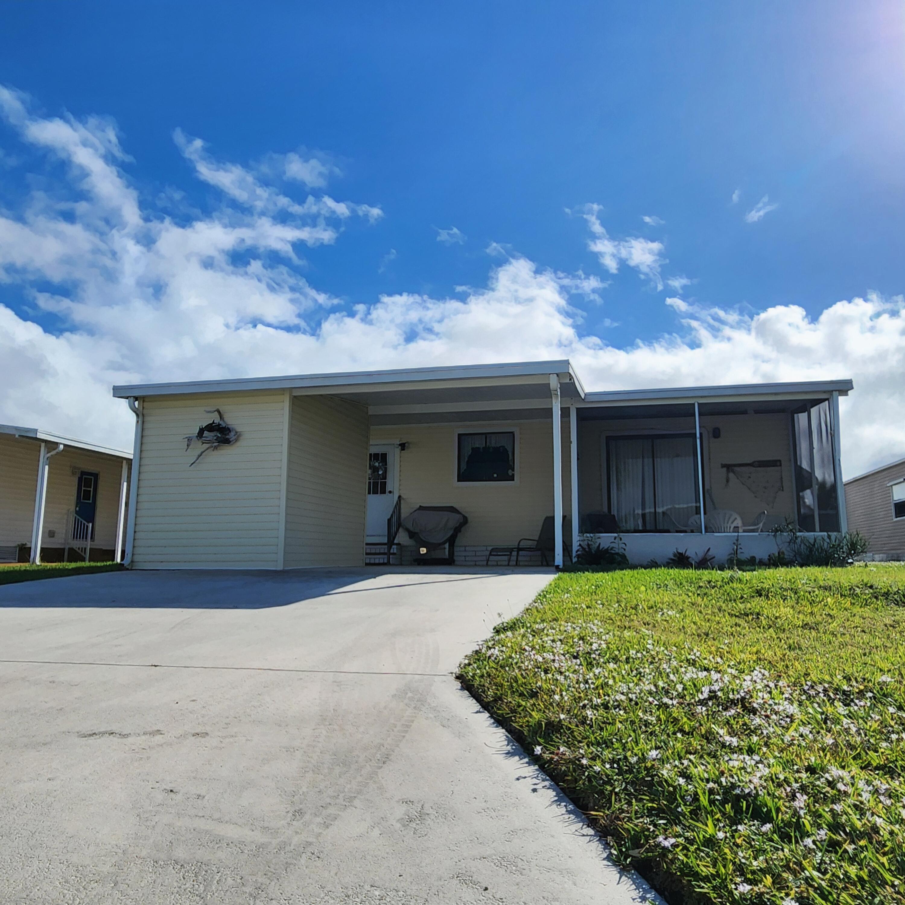 526 Hemingway Terrace, Unit F02 Fort Pierce, FL 34982 - Photo 51 of 55 a view of a house with patio