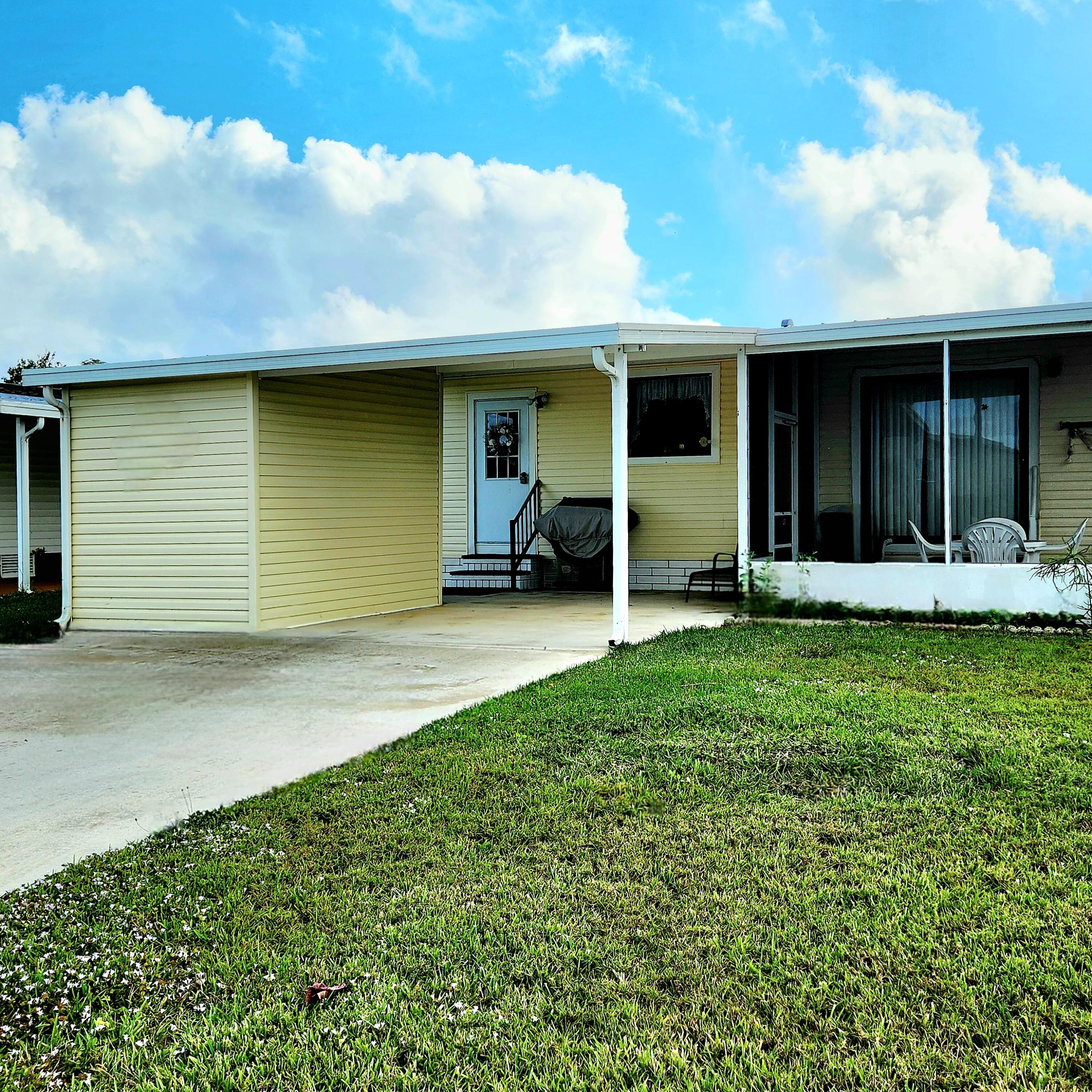 526 Hemingway Terrace, Unit F02 Fort Pierce, FL 34982 - Photo 53 of 55 a view of a house with backyard