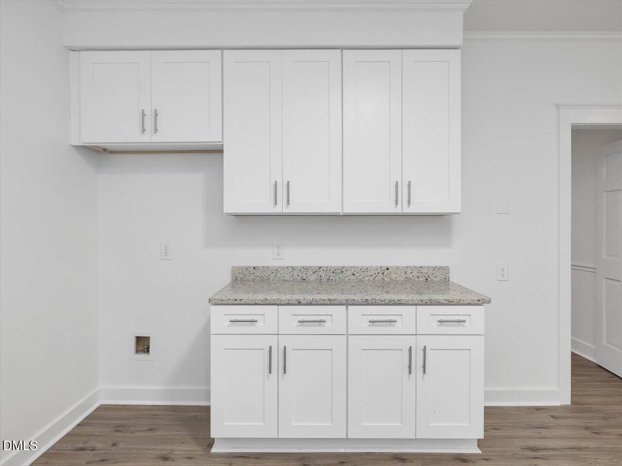 1838 Alex Cockman Road Pittsboro, NC 27312 - Photo 16 of 53 a kitchen with white cabinets and white appliances