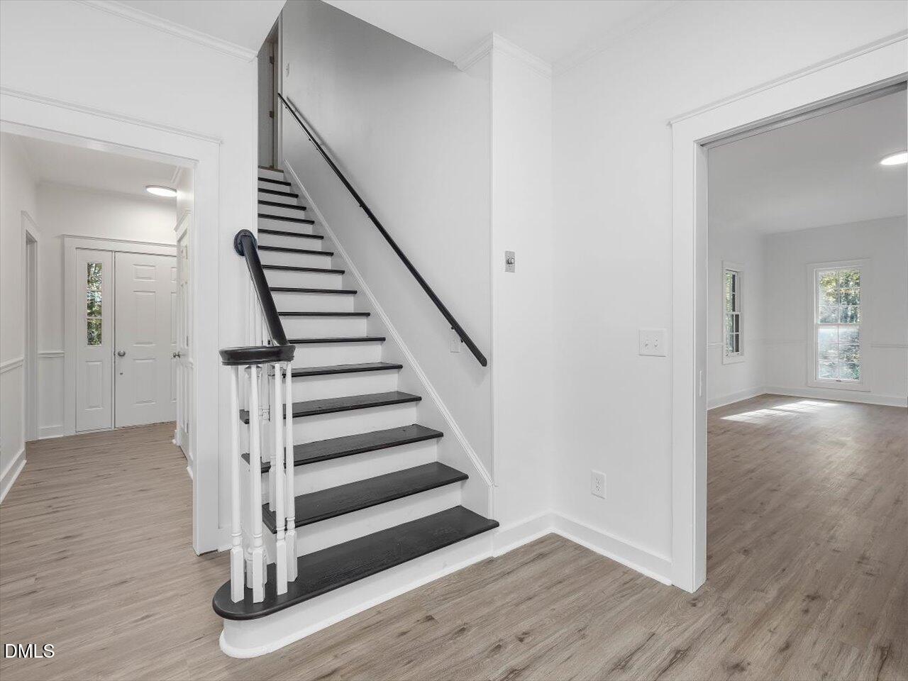 1838 Alex Cockman Road Pittsboro, NC 27312 - Photo 20 of 53 a view of a hallway with wooden floor and entryway