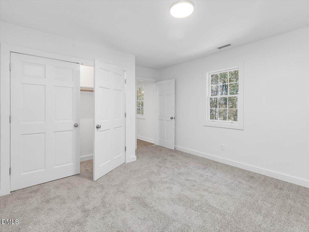1838 Alex Cockman Road Pittsboro, NC 27312 - Photo 28 of 53 an empty room with windows