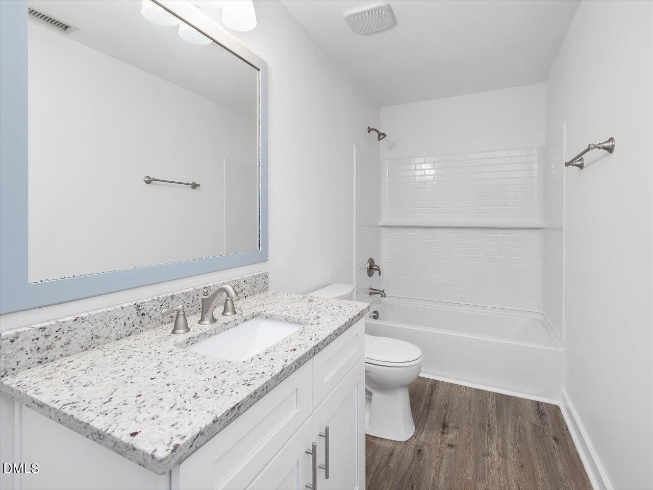 1838 Alex Cockman Road Pittsboro, NC 27312 - Photo 29 of 53 a bathroom with a granite countertop sink a toilet and shower