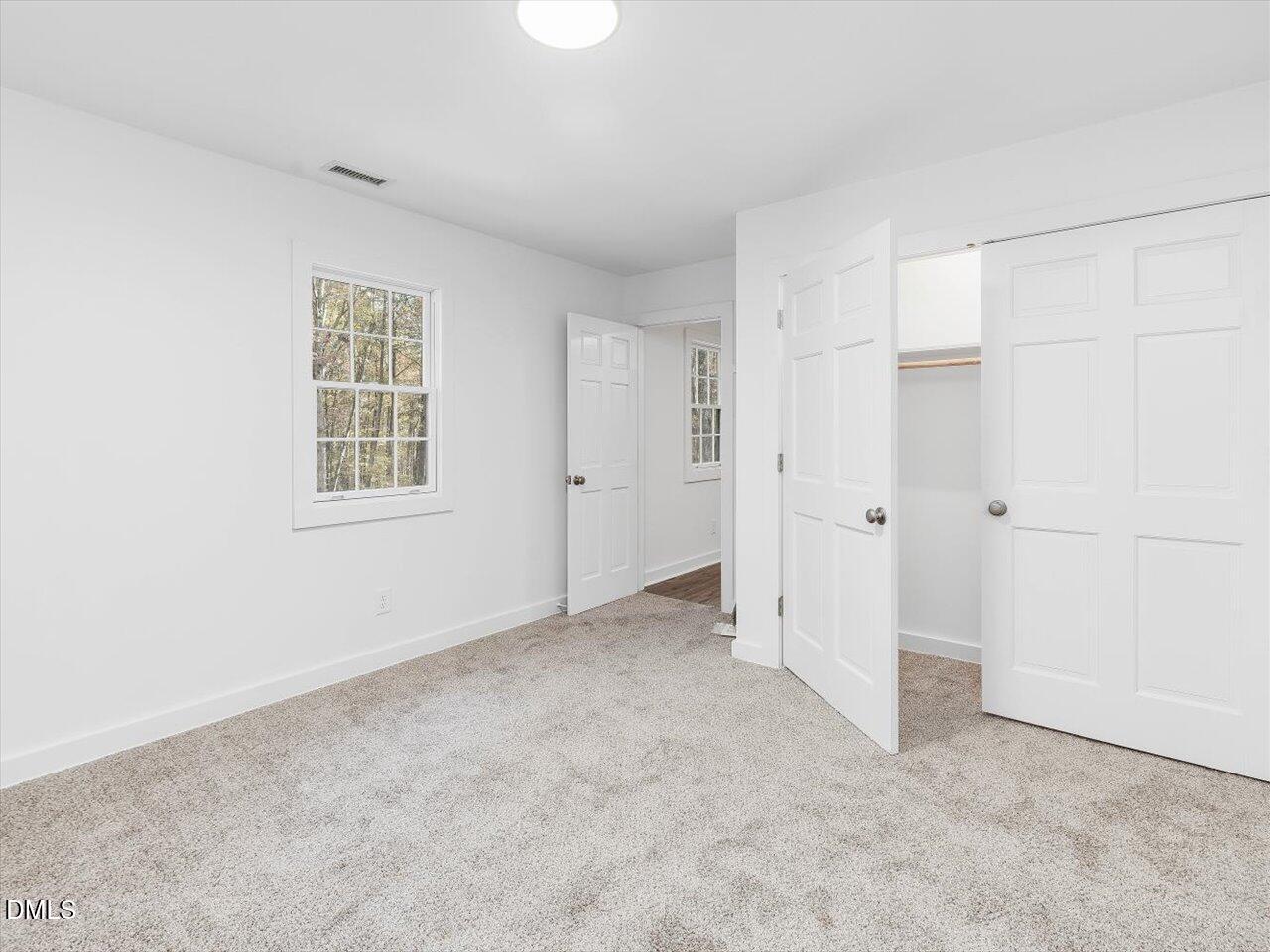 1838 Alex Cockman Road Pittsboro, NC 27312 - Photo 31 of 53 an empty room with windows