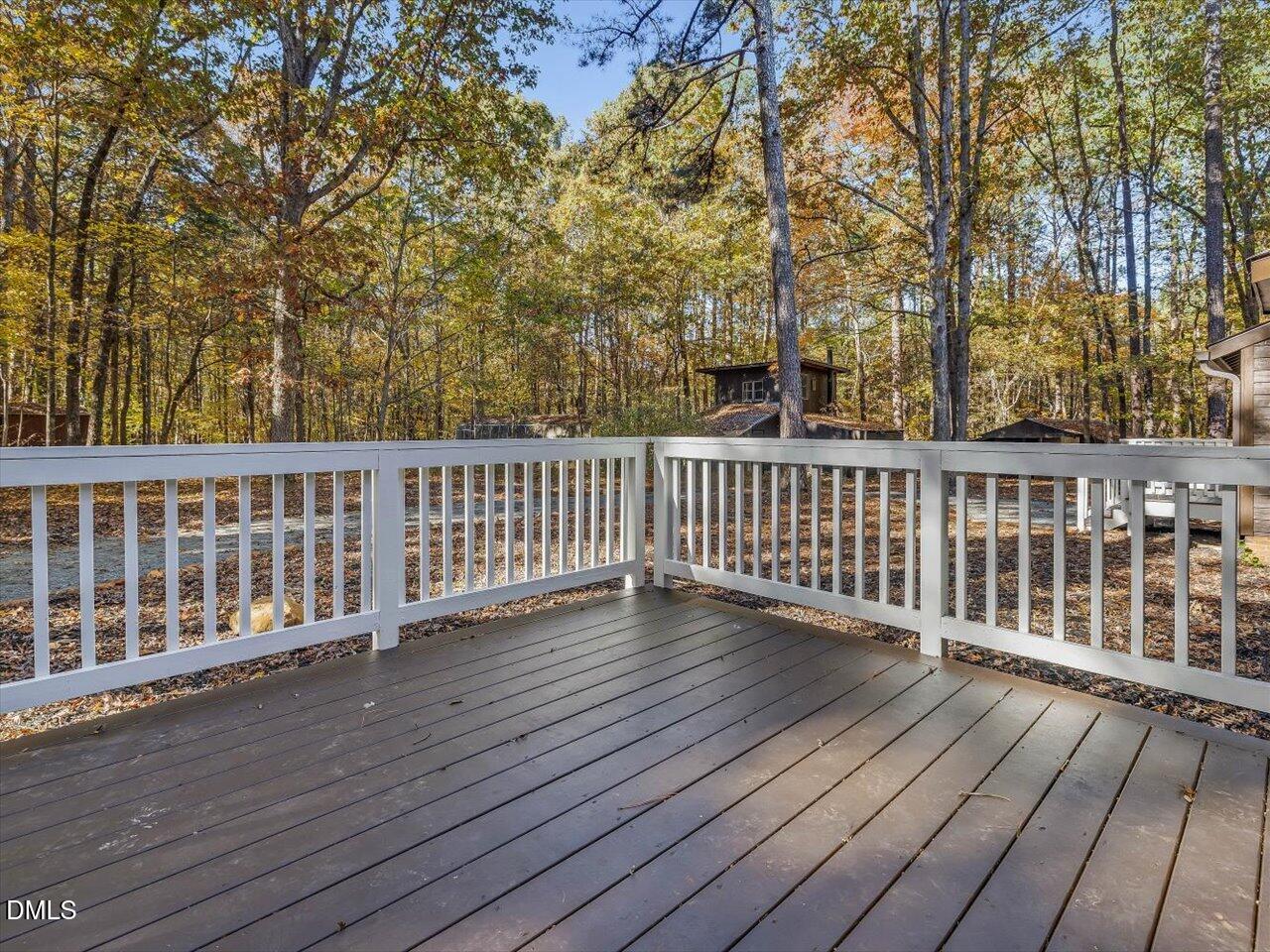 1838 Alex Cockman Road Pittsboro, NC 27312 - Photo 33 of 53 a view of a wooden roof deck