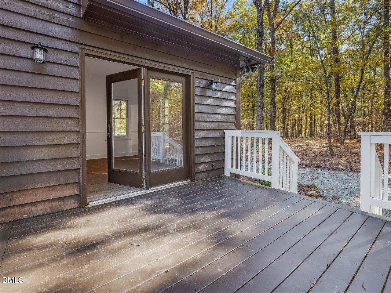 1838 Alex Cockman Road Pittsboro, NC 27312 - Photo 34 of 53 a view of backyard with deck and wooden floor