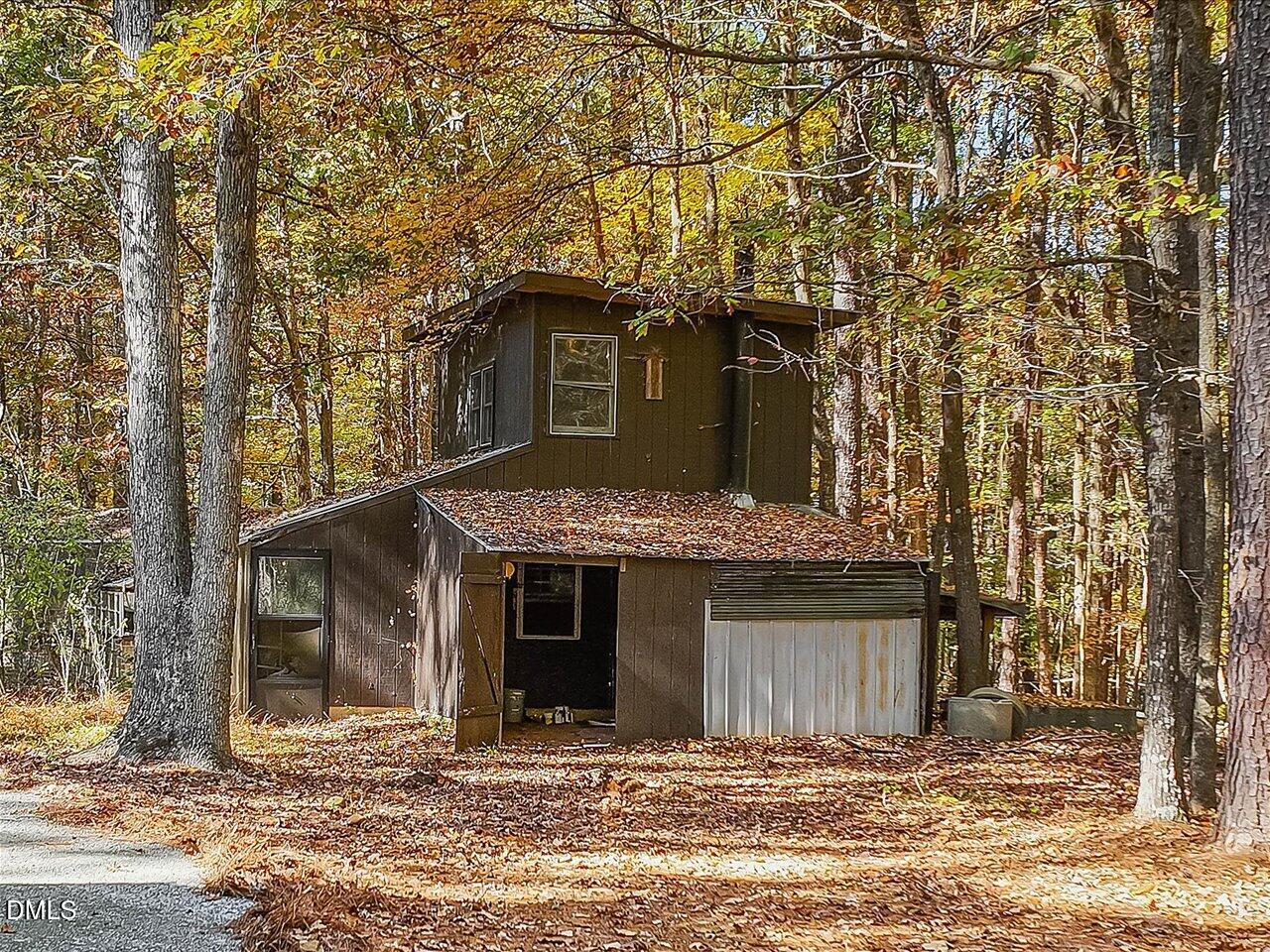 1838 Alex Cockman Road Pittsboro, NC 27312 - Photo 38 of 53 a front view of a house with a yard