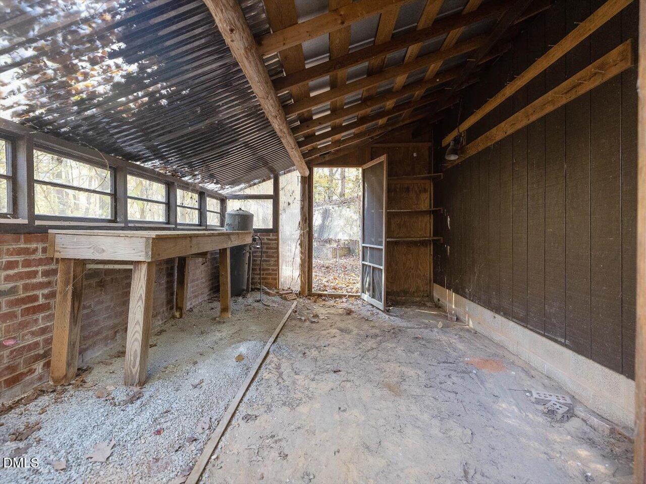 1838 Alex Cockman Road Pittsboro, NC 27312 - Photo 40 of 53 a view of empty room with windows